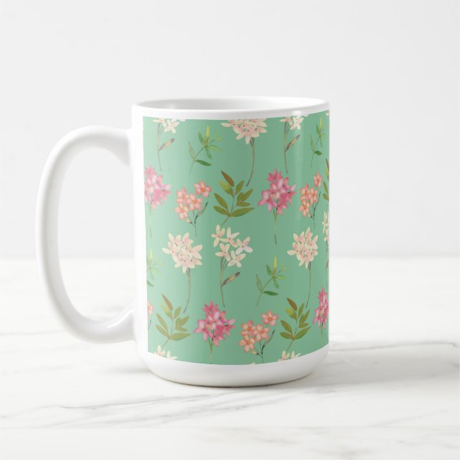 caneca de café com design floral em fundo verde (Esquerda)