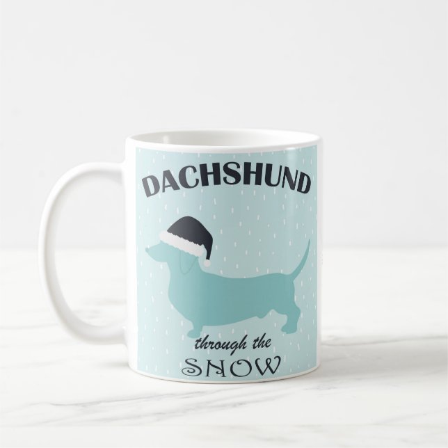 Caneca De Café Dachshund Através do Natal Engraçado da Neve (Esquerda)
