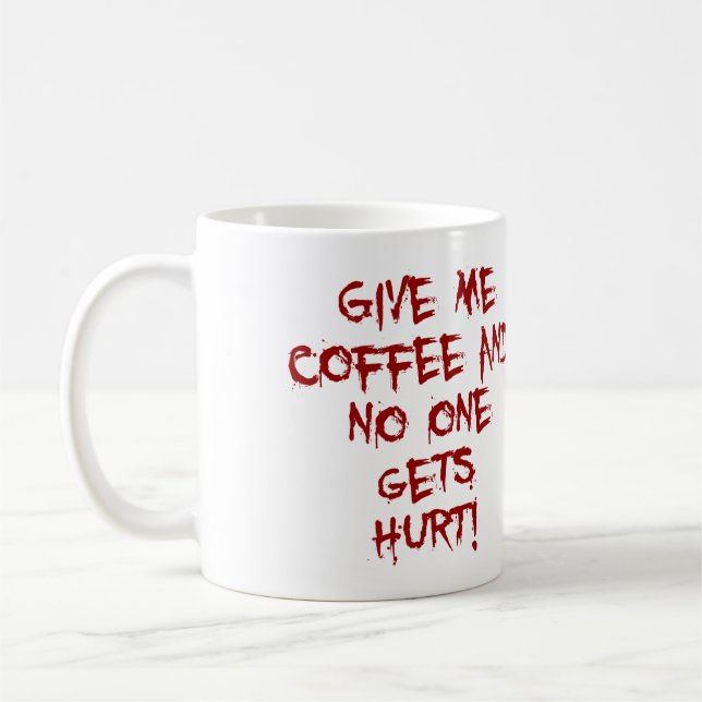 CANECA DE CAFÉ DÊ-ME O CAFÉ E NINGUÉM OBTEM O SPLATTER FERIDO DO (Esquerda)