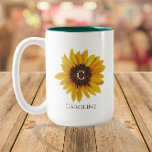 Caneca De Café Em Dois Tons Monograma de Nome com Girassol em Aquarela<br><div class="desc">Este design apresenta uma bela imagem de girassol pintada com espaço para um monograma no centro e um nome/texto abaixo. Clique no botão personalizar para mais flexibilidade ao mover/dimensionar as imagens e modificar o texto! Variações deste design, cores adicionais, bem como produtos coordenados estão disponíveis em nossa loja, zazzle.com/store/doodlelulu. Entre...</div>