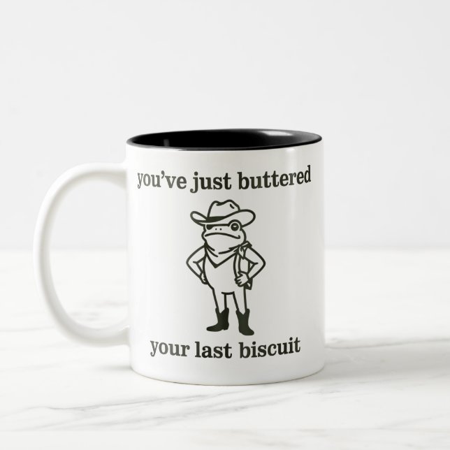 Caneca De Café Em Dois Tons You've just Buttered Your Last Biscuit Cowboy Frog (Esquerda)