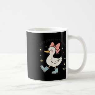 Caneca De Café Ganho Engraçado Do Bobo Nas Botas Da Chuva Do Arco