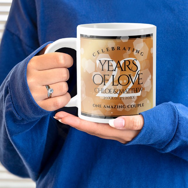 Caneca De Café Grande 22º aniversário do Casamento de Cobre (22nd wedding anniversary jumbo mug held by woman sporting a wedding ring and blue sweatshirt.)