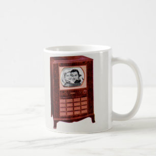 Caneca De Café homem e mulher do aparelho de televisão de cerca d