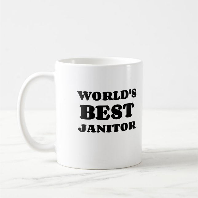 CANECA DE CAFÉ O MELHOR JANITOR DO MUNDO (Esquerda)