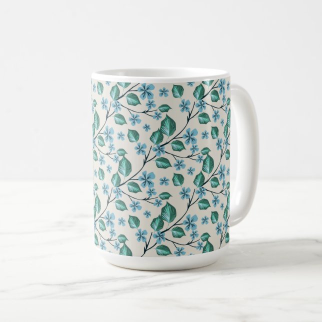 Caneca De Café Ramos com folhas verdes e flores azuis. (Frente Esquerda)