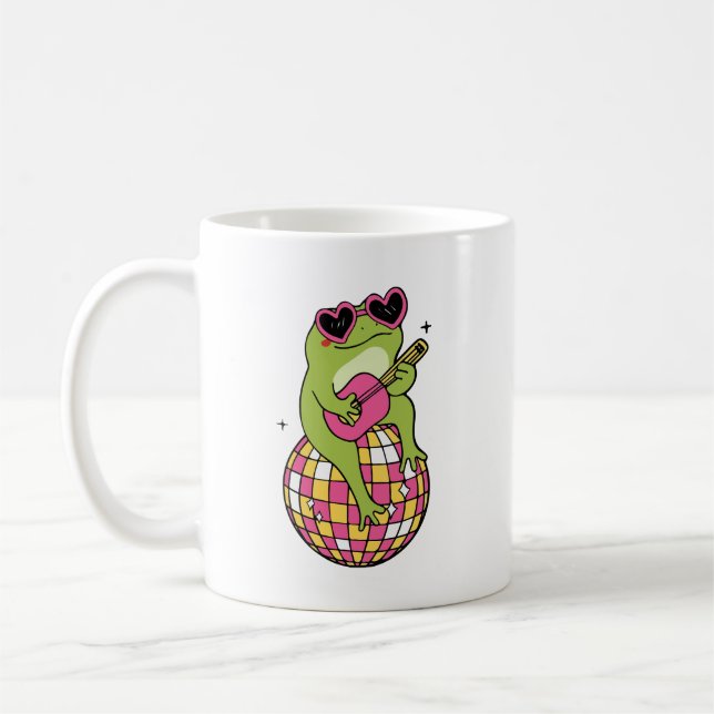 Caneca De Café Sapo sentado na bola de dança tocando violão  (Esquerda)
