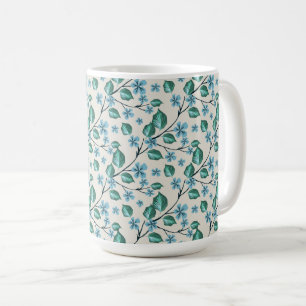Caneca De Café Sprigs com folhas verdes e flores azuis.