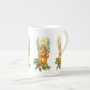 Caneca De Porcelana Anjo Com Azevinho E Bandolim 