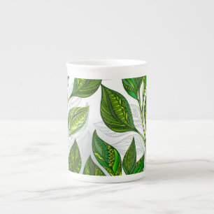 Caneca De Porcelana Padrão sem costura com folhas verdes de chá