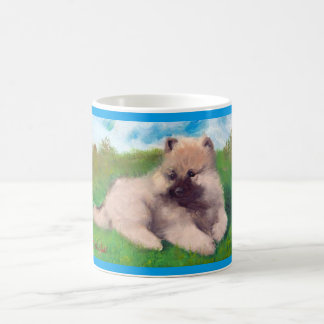 Caneca do filhote de cachorro do Keeshond de