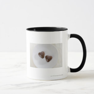 Caneca Doces de chocolate dados forma coração em uma