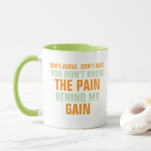Caneca DOR E OBTENÇÃO de texto laranja e verde em branco