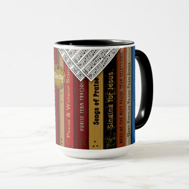 Caneca dos livros de música da equipe do elogio (Frente Esquerda)
