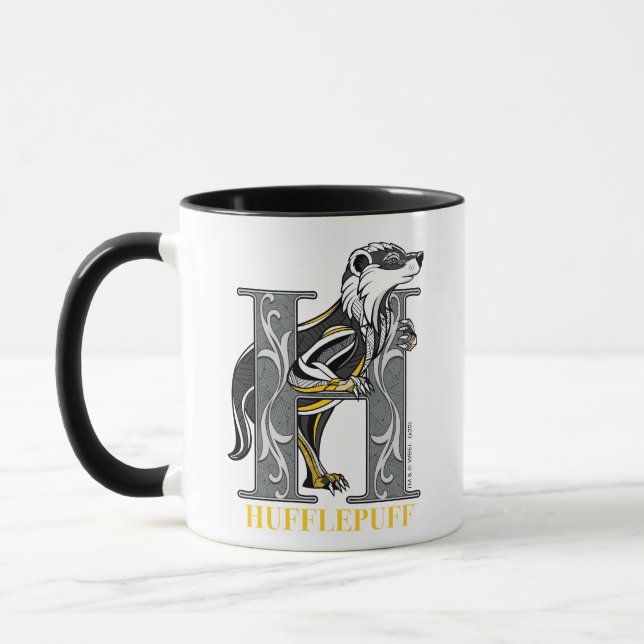 Caneca Emblema com cruz HUFFLEPUFF™ (Esquerda)
