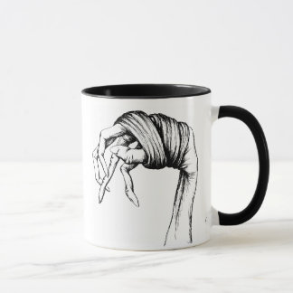Caneca encadernada das mãos