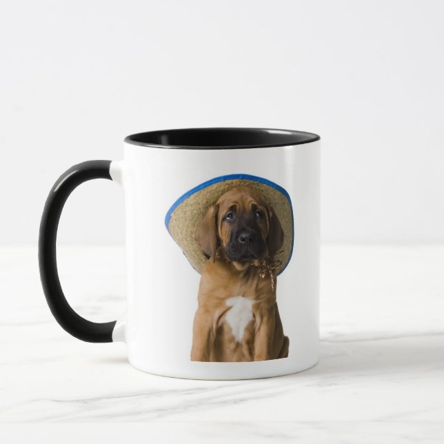 Caneca filhote de cachorro em um chapéu de vaqueiro (Esquerda)