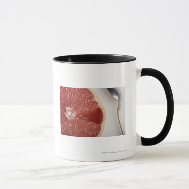 Caneca Fim-acima de uma fatia de laranja e de uma colher (Direita)