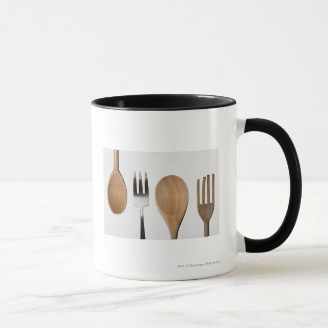 Caneca Fim-acima de uma forquilha com uma colher de (Direita)