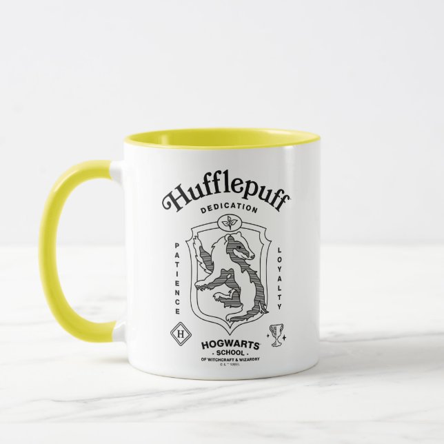Caneca HUFFLEPUFF™ Dedicação Paciência Lealdade Brasão (Esquerda)