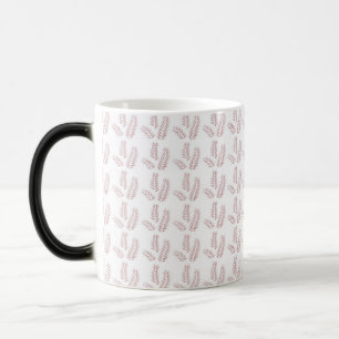 Caneca Mágica um fundo branco com folhas rosa sobre ele