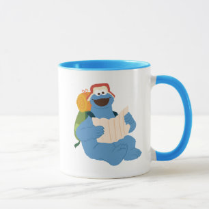 Caneca Monstro De Cookies Lendo Um Mapa