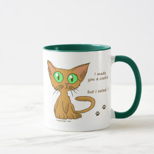 Caneca O gatinho bonito comeu seu biscoito