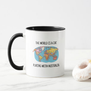 CANECA O MUNDO É UM GATO BRINCANDO COM A AUSTRÁLIA