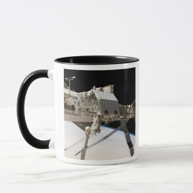 Caneca O sistema robótico Dextre construído no Canadá (Esquerda)