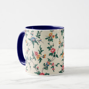 Caneca Padrão de flor multicolorida com acabamento azul-m
