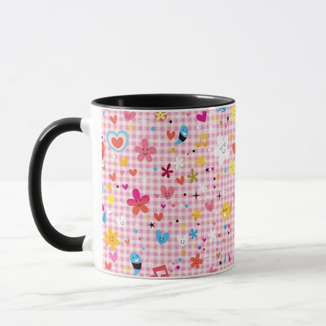 Caneca rosa do teste padrão dos desenhos animados do (Esquerda)