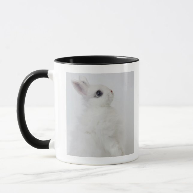 Caneca Um coelho branco. Jérsei Wooly. (Esquerda)