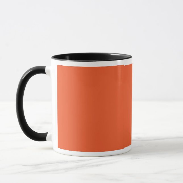 Caneca um fundo laranja com uma borda negra (Esquerda)