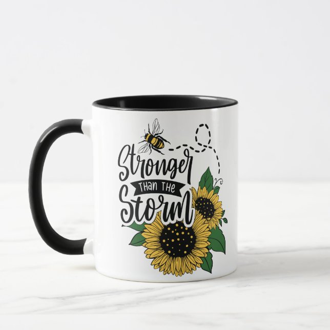 Caneca Você é mais forte que esta tempestade. Um café pre (Esquerda)