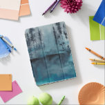 Capa Para iPad Pro Florestas de inverno<br><div class="desc">Winter Woods I de Chariklia Zarris. Apresenta árvores escuras em tons azuis profundos num estilo semelhante a aquarela.</div>