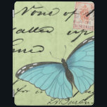 Capa Smart Para iPad Borboleta de asa azul no cartão postal<br><div class="desc">Este cartão postal teal carregar uma mensagem de beleza. Uma delicada borboleta de asas azuis repousa no cartão,  ocultando alguns dos escritos que contém. Este impressão do Vision Studio faria um excelente adicional para sua casa!</div>