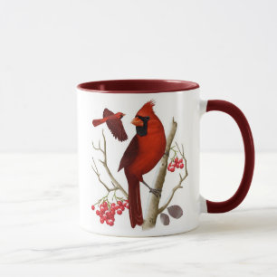 "Cardeais" na caneca de café selvagem do pássaro