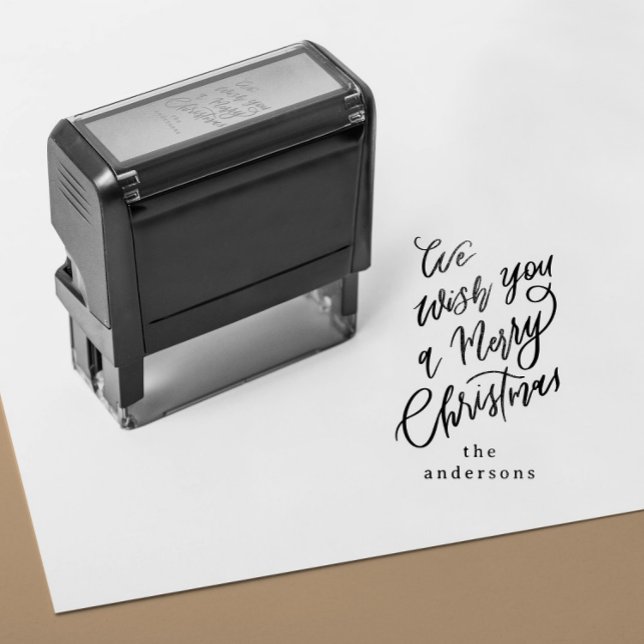 Carimbo Auto Entintado Desejamos-lhe um presente feliz de Natal (self inking stamp with a hand lettering Merry Christmas message and custom family name)