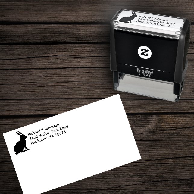 Carimbo Auto Entintado Sentado do lado negro do coelho (Silhouette of sitting rabbit on self inking returnn address stamp.)