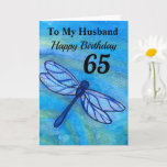 Cartão 65th For My Husband Blue Dragonfly Aniversário<br><div class="desc">Celebre o aniversário de 65 anos do seu marido num cartão azul de libélula. Criado da minha pintura de aquarela original,  o inseto caprichoso voa pacificamente com cores azuis,  pretas e verdes lacrimogêneas do oceano. Aproveite a mensagem dos parabéns com todo o seu amor.</div>