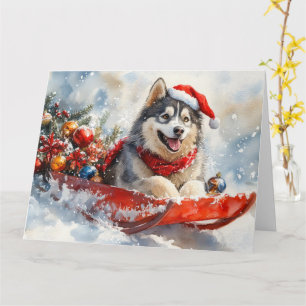 Cartão Alaskan Malamute em Sledge Deixe-o nevar no Natal