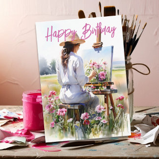Cartão Artista Feminina Pintando Flores em um Campo de An
