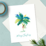 Cartão Árvore Tropical de Palma Cria Aquarela Praia Natal<br><div class="desc">Este cartão de natal com aquarelas do tema da praia apresenta uma réplica da minha palmeira original pintada com poinsettia vermelha em um fundo branco nítido. As palavras Feliz Natal são escritas em uma tipografia moderna de pincel azul-turquesa. O dentro é uma cor verde tropical clara sólida e é vazio...</div>