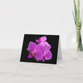 Cartão As orquídeas roxas dramáticas em um preto dobraram