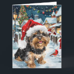 Cartão Biewer Terrier Dog Winter Wonderland Natal Joy<br><div class="desc">Este design festivo captura o espírito alegre da época de férias, apresentando um adorável filhote vestindo um chapéu de Papai Noel. O cachorro está aninhado numa terra maravilhosa de inverno, completo com um boneco de neve, uma árvore de Natal decorada, e presentes lindamente envoltos. Os flocos de neve caem suavemente,...</div>