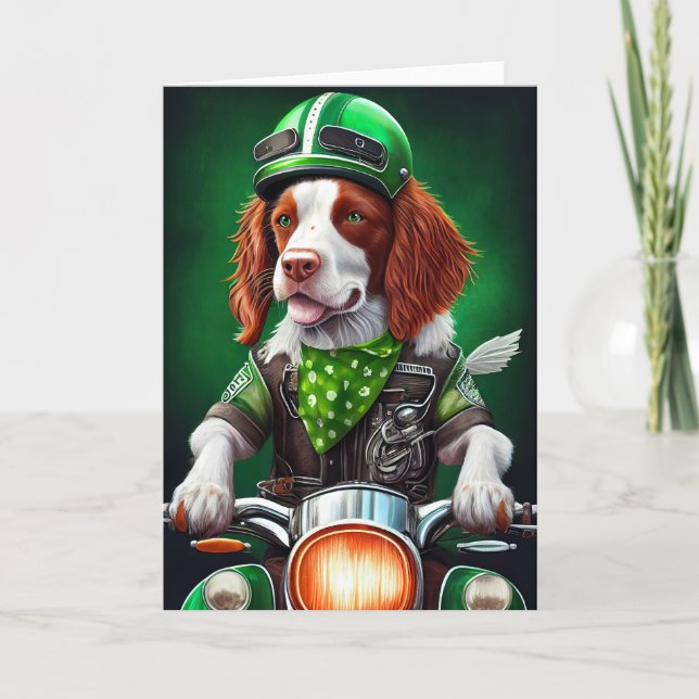 Cartão Brittany Spaniel pilotando bicicleta no Dia de São (Frente)