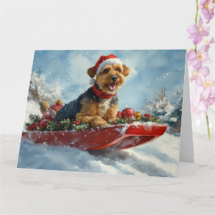 Cartão Cachorro Airedale no Trenó Deixe Nevar Natal