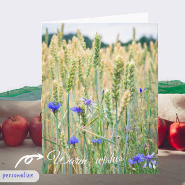 Cartão Campo de trigo com flores azuis