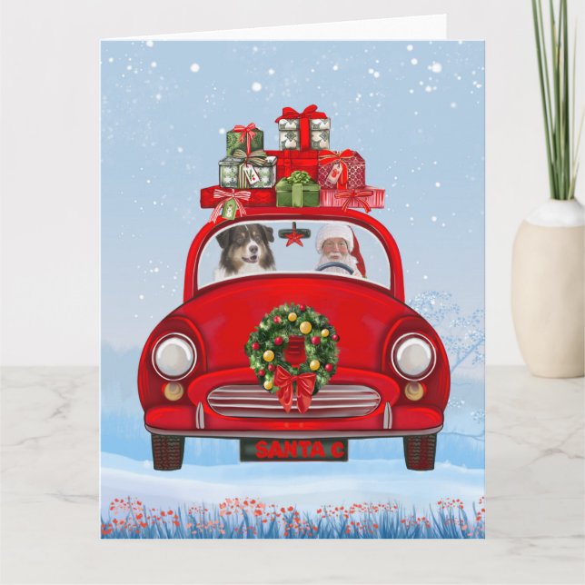Cartão Cão pastor australiano no carro com Papai Noel  (Frente)