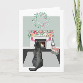 Cartão Cena de cachorro Labrador preto no Natal na lareir